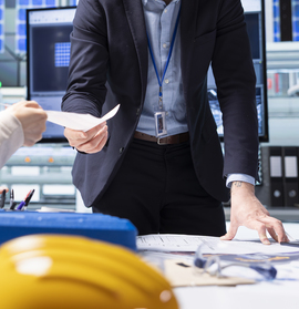 Shareholders reading report of industrial production growth opportunities and technological insights found during research and development process. Factory manager offers investors documentation files